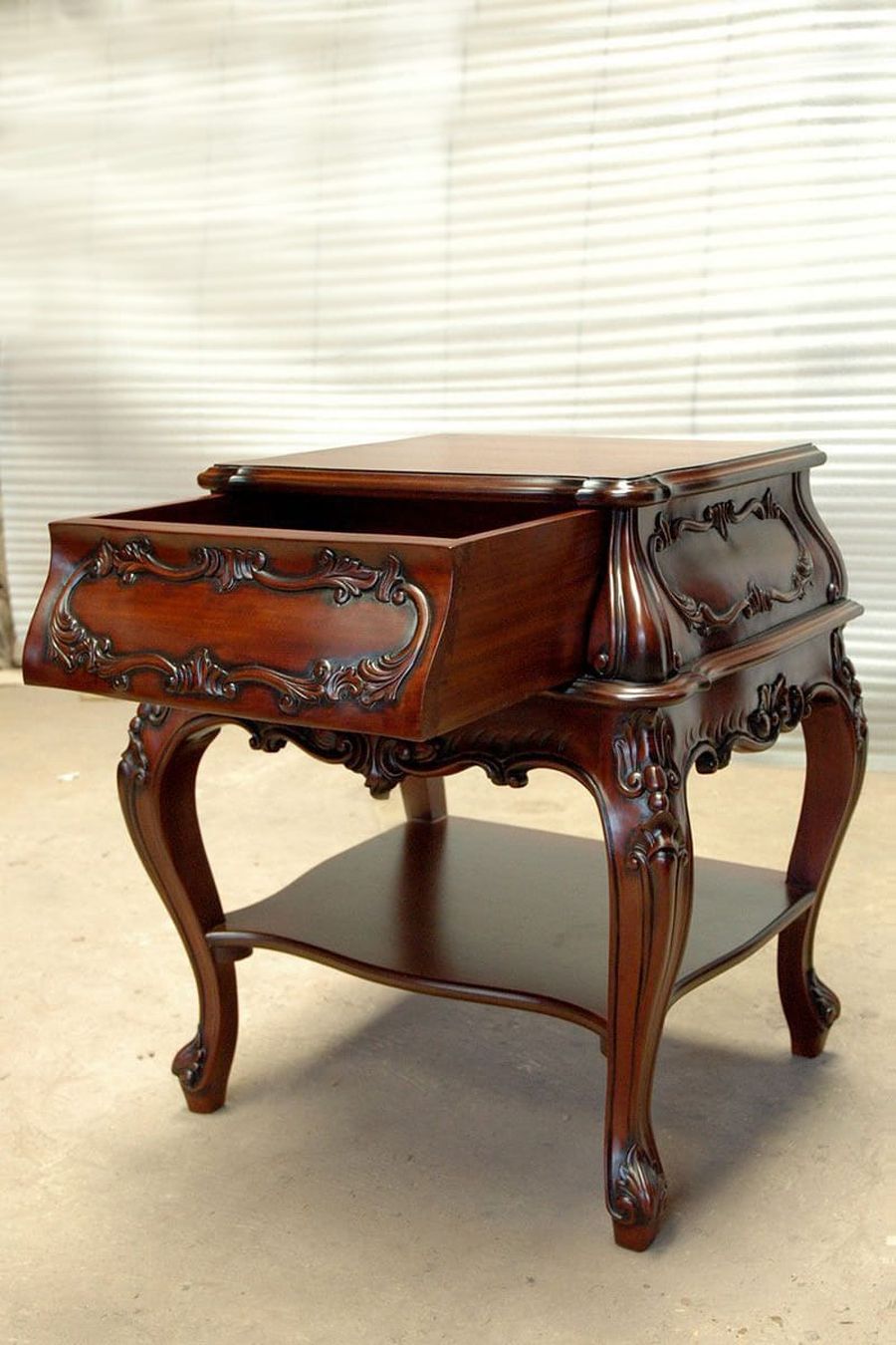 The drawer of the bombee bedside pulled out