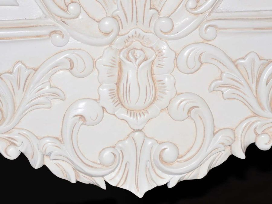 Beautiful elaborate carving on the bottom of the footboard.