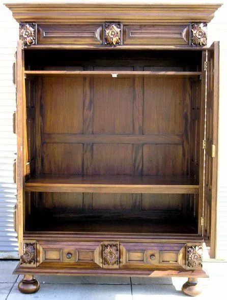 The compartment of the Dutch Flanders paneled armoire door opened