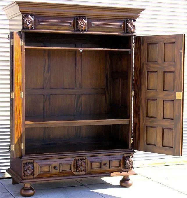 Two drawers and bun feet the bottom detail of Dutch Flanders paneled armoire