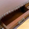 Dovetailed drawers and top leaf carving edges detail