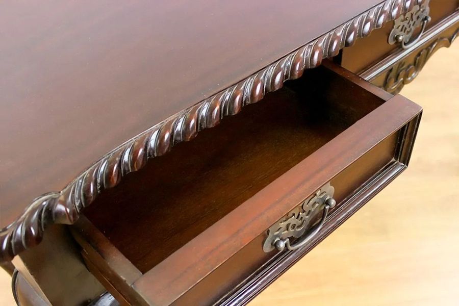 Dovetailed drawers and top leaf carving edges detail