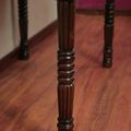 Turned wood leg detail of the colonial console table