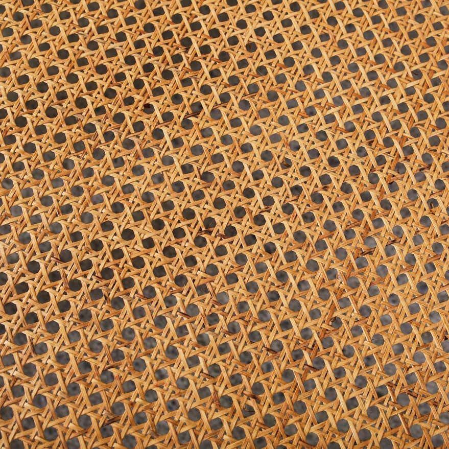 Hexagonal rattan skin pattern on the seat of colonial lazy chair