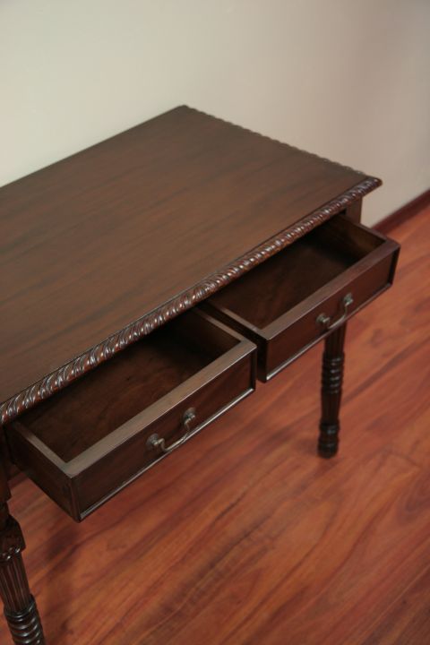 2 drawers on the front side of the colonial console pulled out