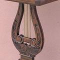 Mahogany wood carving and solid brass strings
