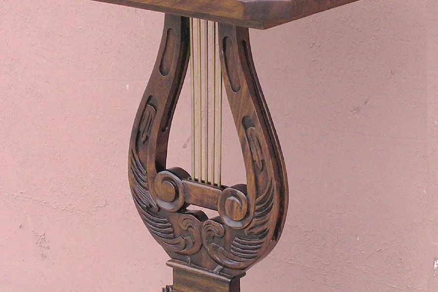 Mahogany wood carving and solid brass strings