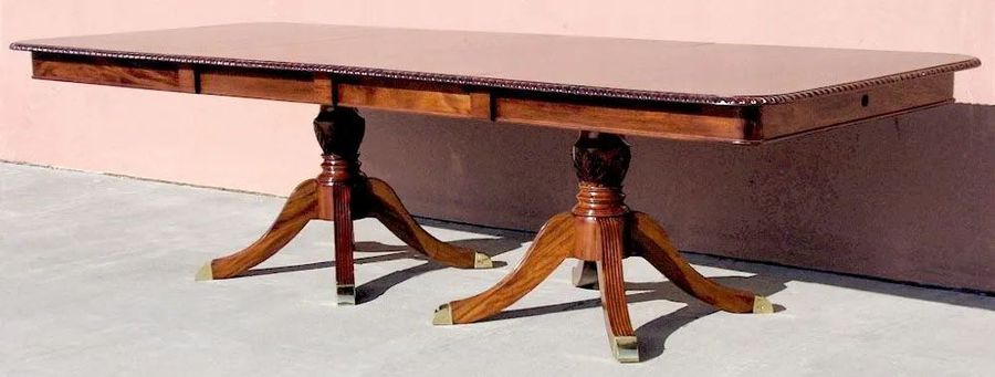 Regency dining table using two extensions on two pedestals