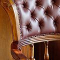 Diamond tufted backrest upholstery of Victorian swiveled chair