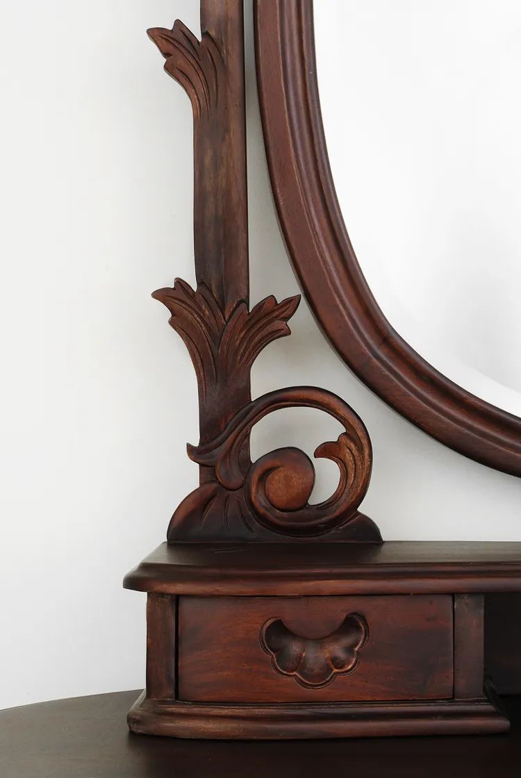 Oval mirror detailed view of Victorian bedroom vanity