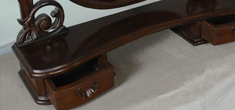 Mirror frame and drawer carving detail of Victorian bedroom vanity