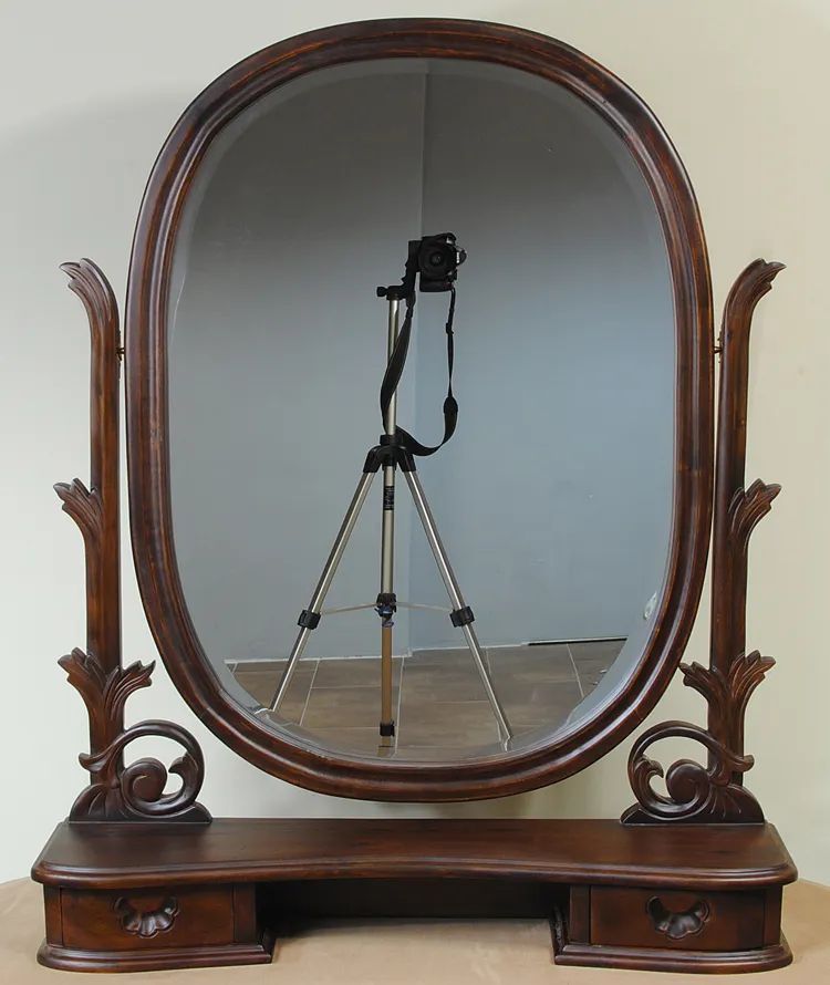 Oval mirror small drawer base on the top of Victorian dressing table