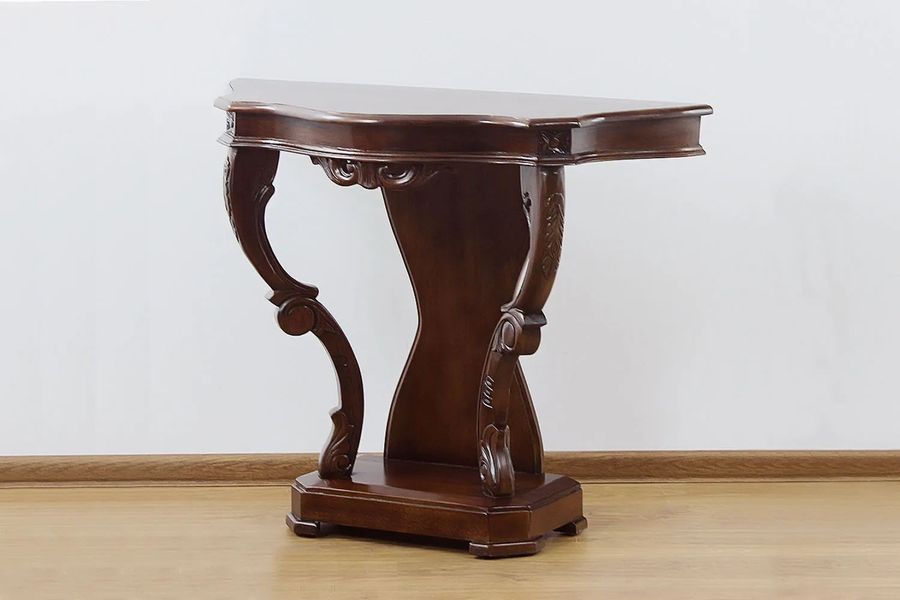 Right side detailed view of fiddle carving wall table