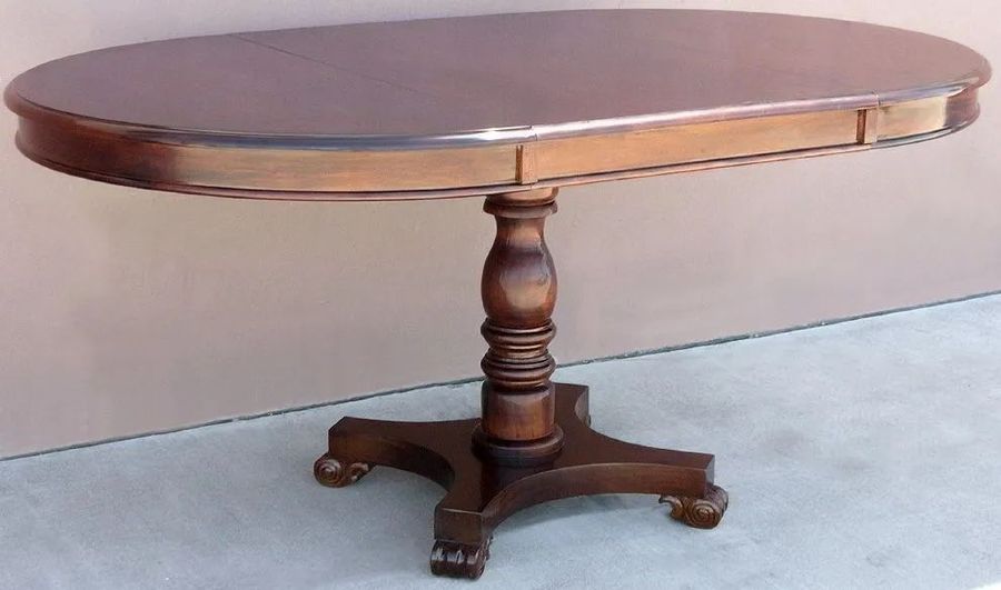 Pedestal table extended to oval shape top