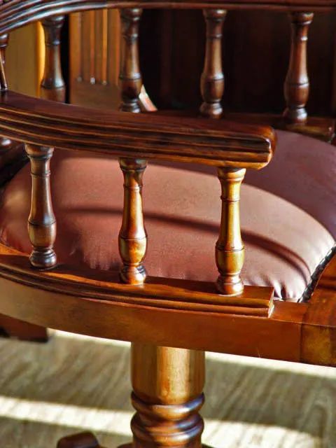 Arm rest detail of Victorian swiveled office chair