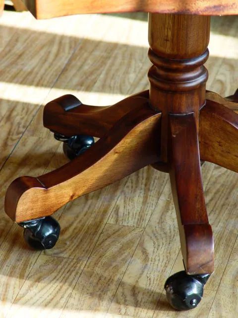 Spread legs and casters of the Victorian swiveled chair