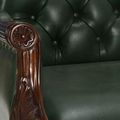 Flower carving on rounded arm rest