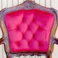 Diamond tufted backrest of the rococo armchair