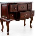 The drawers of dark brown finish Louis XV breakfront dresser pulled out