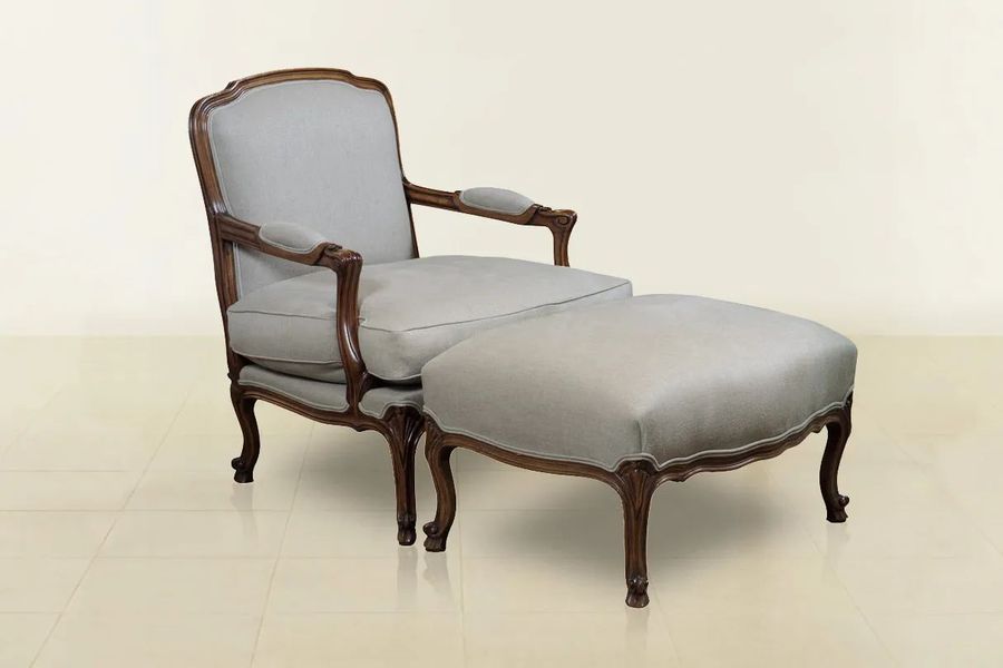 Louis XV bergere in classic mahogany finishes with gray fabric upholstery