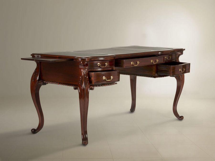 A tray on the left side and five draws front of the bureau plat pulled out