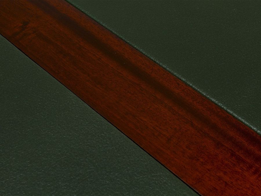 Leather inlay on the writing surface of the bureu plat