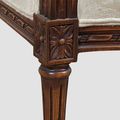 Wood carving on the seat rails of Louis XVI empire bergere mahogany wood frame