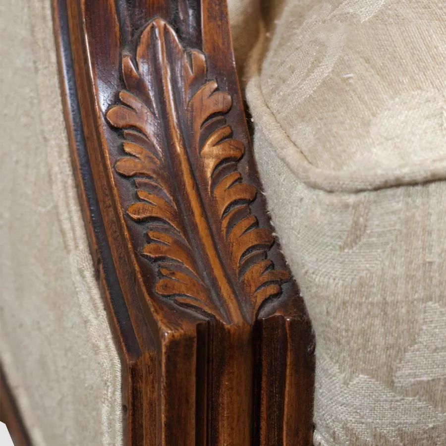 Wood carving detail on the arm of Louis XVI empire bergere mahogany wood frame