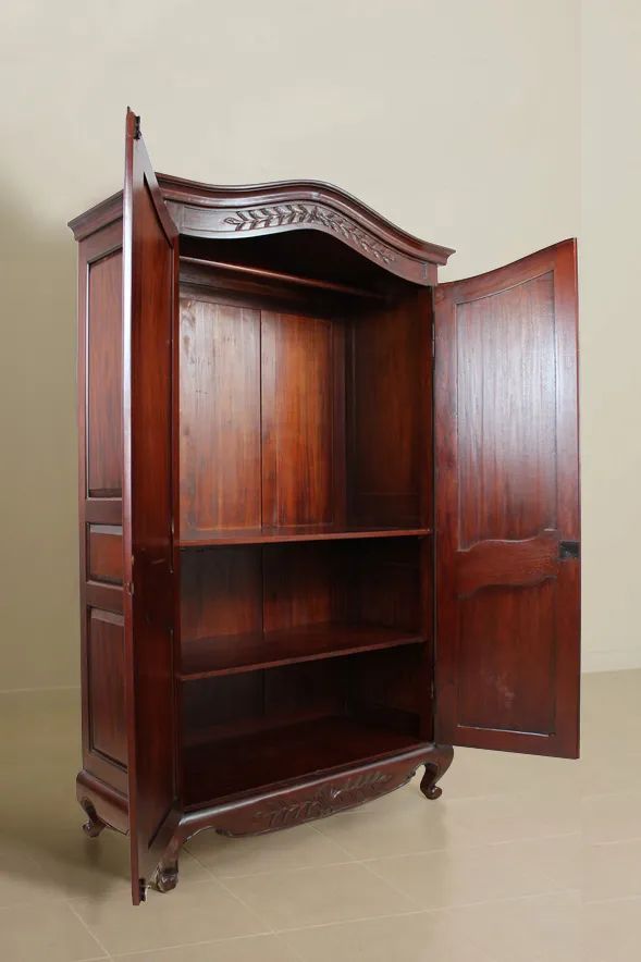 Paneled doors of the French classic bonnet top armoire 