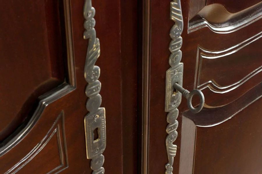 Solid brass doors lock and handle of the French classic bonnet top armoire 