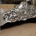 Footboard carving detail of silver painted rococo bed