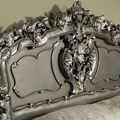 Headboard carving detail of silver painted rococo bed