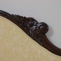 Backrest rail wood carving and upholstery edge detail