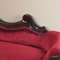 Right end detail of Rococo red velvet sofa