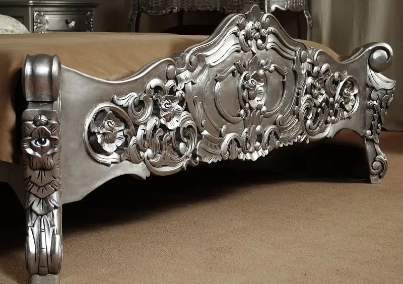 Footboard carving detail of silver painted rococo bed