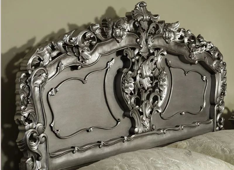 Headboard carving detail of silver painted rococo bed