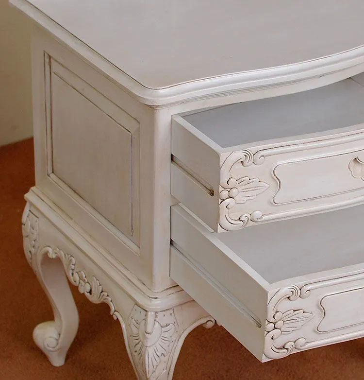 White painted drawers detail of Rococo nightstand
