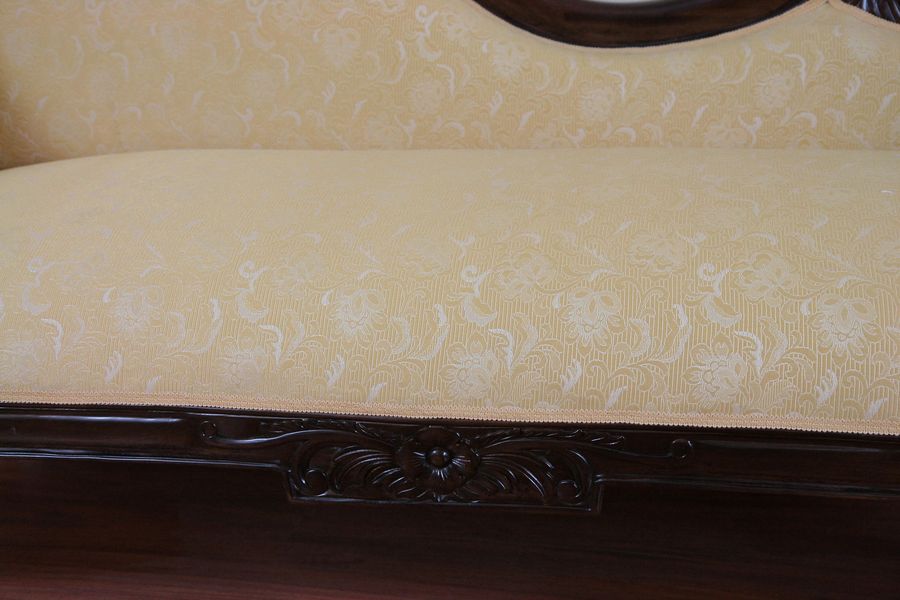 Rose carving on the seat front rails