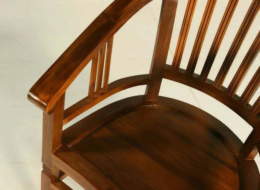 Wood seat detail of the Batavia teak wood armchair