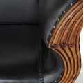 Wood carving detail on the frame of Teak leather loveseat