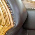 Wood carving detail on the frame of Teak leather sofa 3 seats