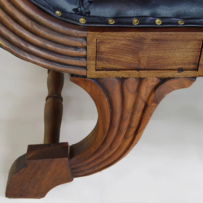 Legs detail of the Teak leather lounge chair