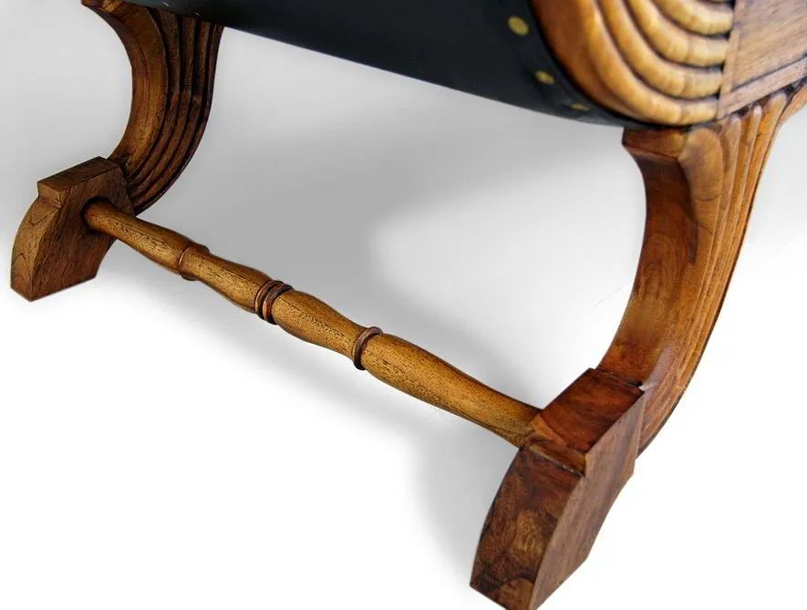 Legs and stretcher detail of the Teak leather sofa 3 seats