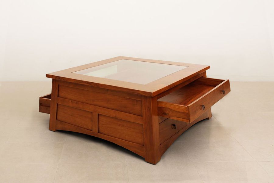 Two large drawer of the Altar trapezoid center table pulled out