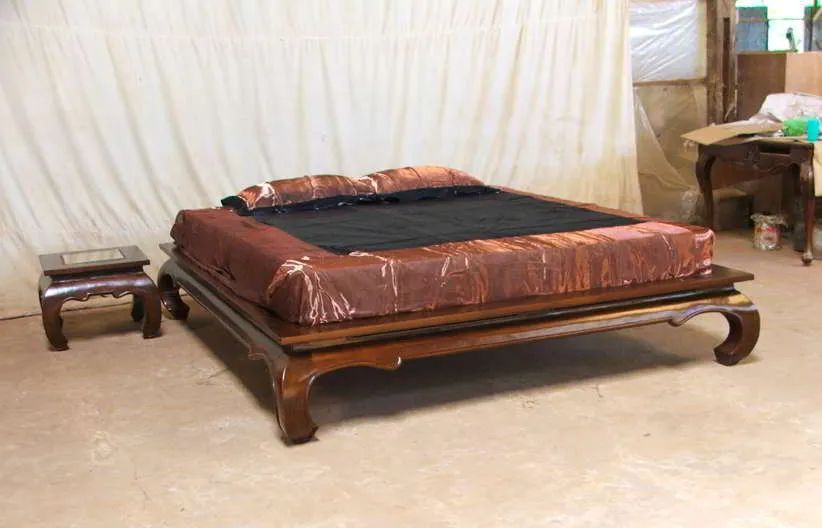 Opium custom bedframe made of teak wood