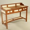 Teak wood desk accented with bamboo wicker panels