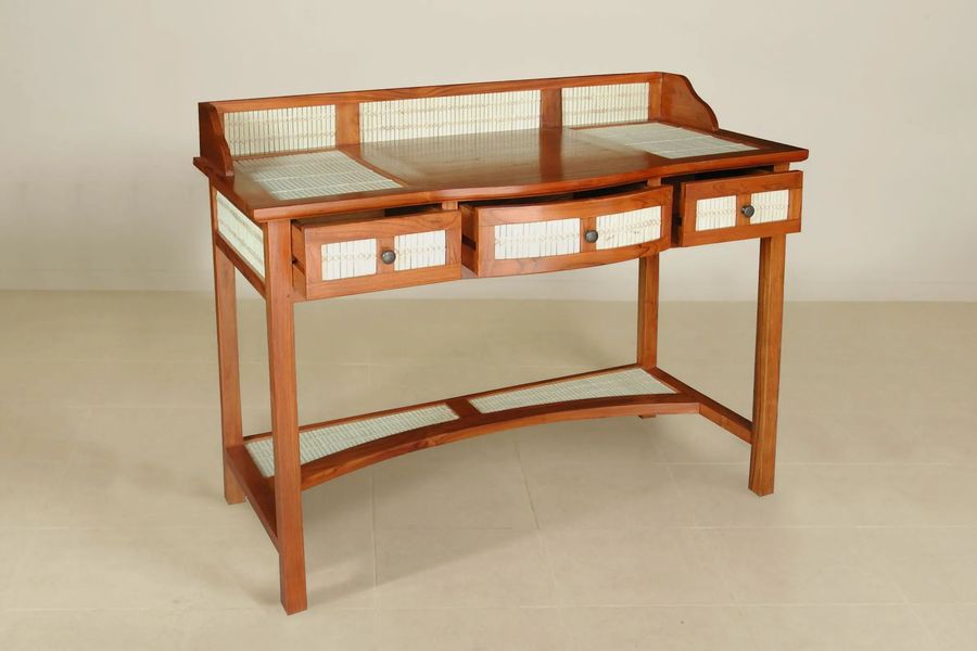 Three drawers under the desktop pulled out