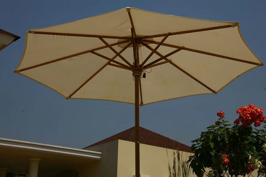 Teak parasol opened