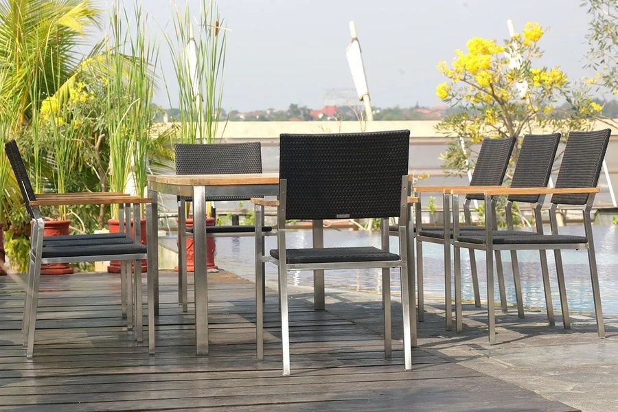 Stainless steel arm chair at pool side