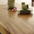 Cross grained detail on the top of Live edge single block solid wood slab dining table
